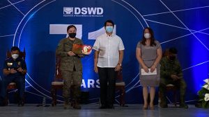 Department of Social Welfare and Development Secretary Rolando Joselito Bautista, Field Office X Director Mari-Flor Dollaga-Libang, and Lieutenant Colonel Jenny De Mesa pose for a souvenir photo after the awarding of the Salamat po Awards on March 25.