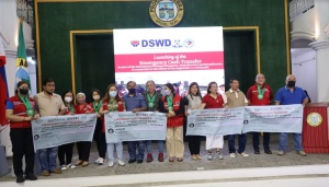 Some of the local government units as they receive their ceremonial checks for the implementation of the Emergency Cash Transfer (ECT) in their respective jurisdictions during the launching ceremony on October 10 in Abra.