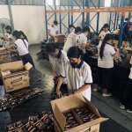 Volunteers from the Church of God International repack coffee sachets for distribution to families affected by Severe Tropical Storm Paeng at the National Resource Operations Center (NROC).