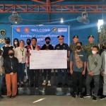 Undersecretary for Inclusive and Sustainable Peace Alan A. Tanjusay (in red vest) attends the awarding ceremony of livelihood settlement grants to 17 former rebels on Tuesday, December 20, in Taguig City.