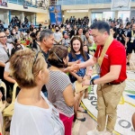 Department of Social Welfare and Development (DSWD) Secretary Rex Gatchalian greets the residents affected by the 6.0 magnitude earthquake at the financial assistance payout venue in Compostela Municipal Gym in Davao de Oro.
