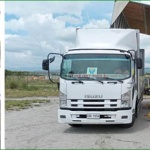 Department of Social Welfare and Development (DSWD) Field Office personnel unload boxes of family food packs and hygiene kits at the Cebu Pacific Cargo Office in Davao International Airport (photo 1) and General Santos International Airport (photo 2).