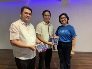 DSWD Information and Communication Technology Management Service Director Andrew Ambubuyog (center) receives five pocket wifi units from Globe Account Manager for Government Account Carolina Dela Costa (left) on Wednesday, March 15, at the QC-X Building of the Quezon Memorial Circle.