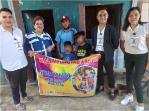 Alvin and his children in their new house in Cebu.