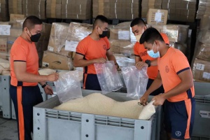 Ever-ready volunteers assist in the repacking of various relief goods at the Department of Social Welfare and Development's (DSWD) National Resource Operations Center (NROC) in Pasay City.