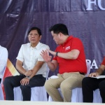President Ferdinand R. Marcos Jr listens as Department of Social Welfare and Development (DSWD) Secretary Rex Gatchalian gestures and stresses a point during the launching of Walang Gutom 2027: Food Stamp Program on Sept. 29, 2023 in Caraga Region. (File Photo)