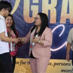 Jude Anthony Oriondo, a blind person, receives his certificate of training completion from Department of Social Welfare and Development (DSWD) Assistant Secretary Elaine F. Fallarcuna during the 70th commencement exercise on Friday (May 10) conducted by the National Vocational Rehabilitation Center (NVRC) for persons with disabilities who finished social and vocational training at the center.