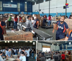 Volunteers help prepare family food packs (FFPs) at the National Resource Operations Center (NROC) on Friday (July 26).  The boxes of FFPs that are being produced by the volunteers will replenish the relief supplies that were distributed to families and individuals who were affected by Typhoon Carina and the ‘Habagat’ in order to  achieve the 100 percent maximum capacity of the warehouse. The NROC is the main disaster response hub of the Department of Social Welfare and Development (DSWD) located along Chapel Road in Pasay City, Metro Manila.